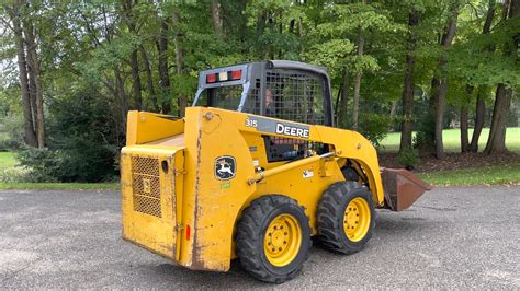 changing attachments on john deere 315 skid steer|john deere 315g.